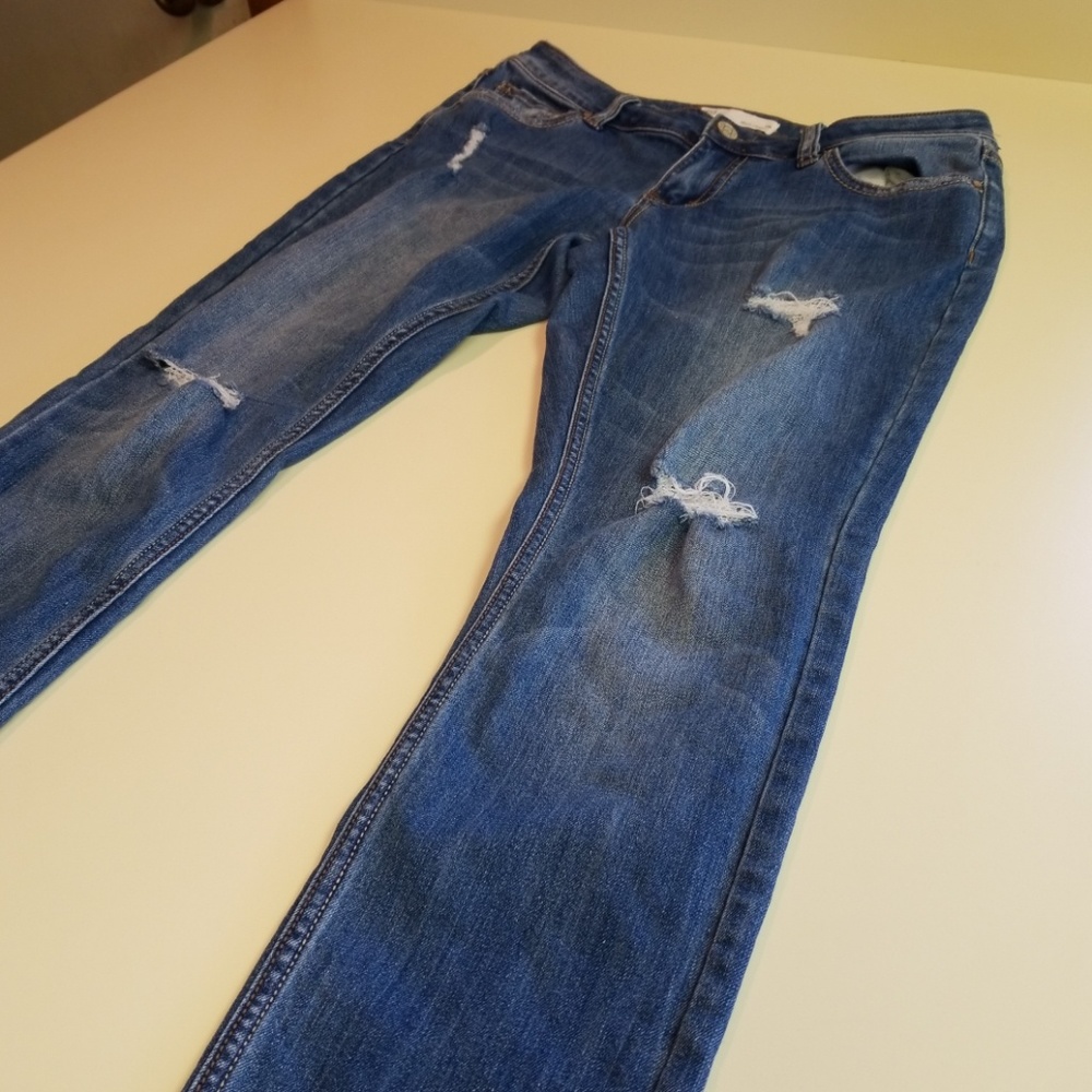 Light blue distressed skinny jeans.